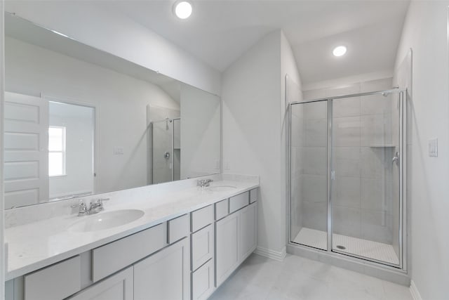 bathroom with vanity, tile patterned flooring, and a shower with shower door