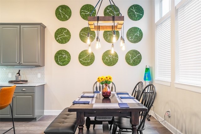 dining space with dark wood-type flooring