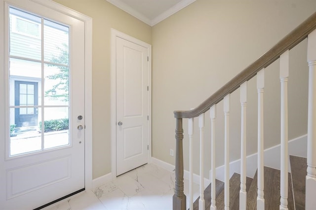 entryway featuring plenty of natural light, crown molding, and light tile patterned floors