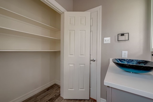 interior space with dark hardwood / wood-style floors and sink