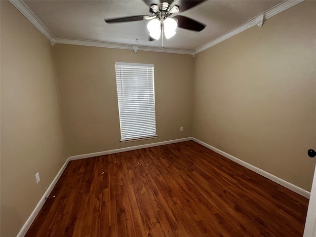 spare room with ceiling fan, dark hardwood / wood-style flooring, and crown molding