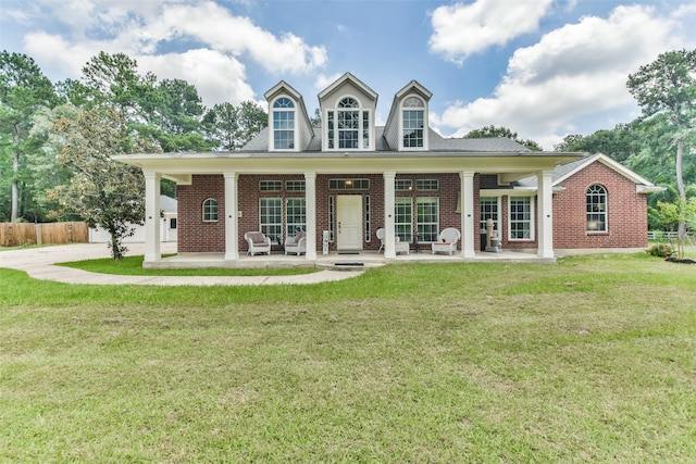 cape cod-style house with a porch and a front lawn