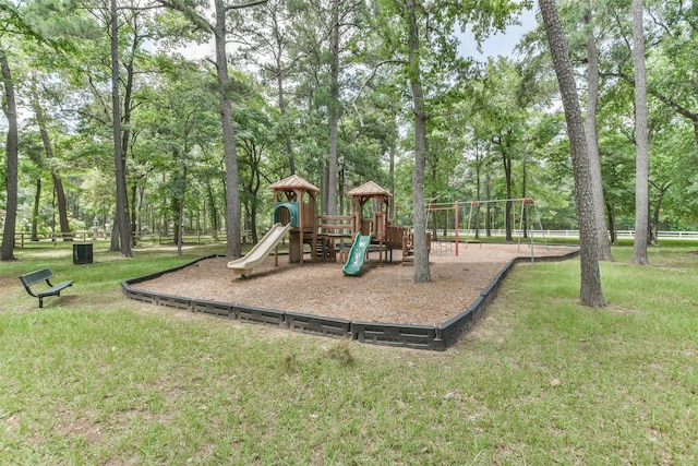 view of playground with a lawn