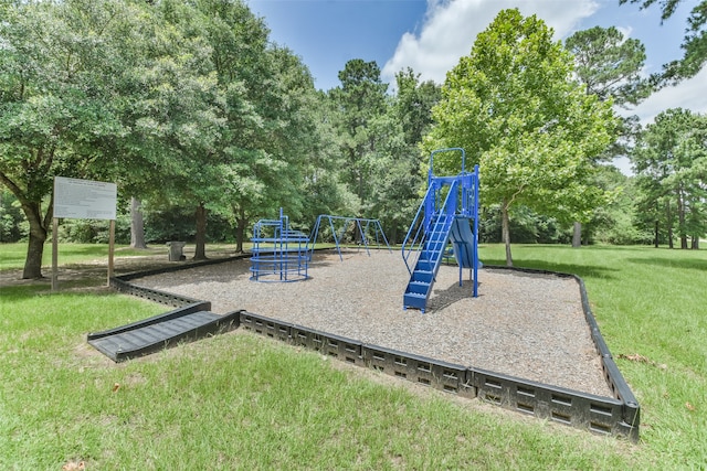 view of jungle gym featuring a lawn