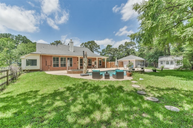 back of house featuring a yard and a patio