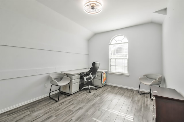 office area featuring lofted ceiling and light wood-type flooring