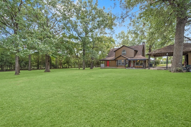 view of yard with covered porch