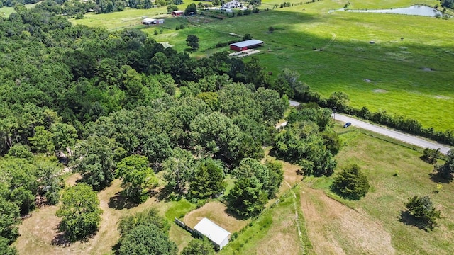 drone / aerial view featuring a rural view and a water view