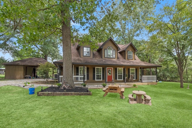 view of front of house with a porch and a front lawn