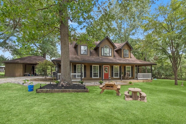 view of front facade with a front lawn and a porch