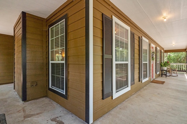 view of property exterior with a porch