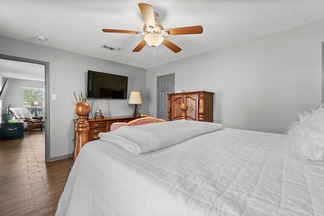 bedroom with hardwood / wood-style flooring and ceiling fan