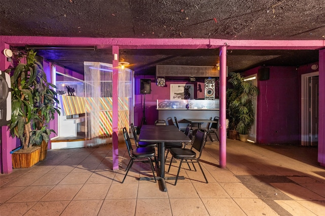 dining space featuring light tile patterned floors