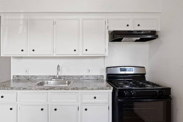 kitchen with sink, white cabinetry, range hood, and gas range oven