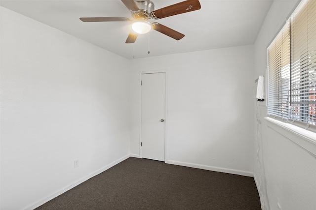 carpeted empty room featuring ceiling fan