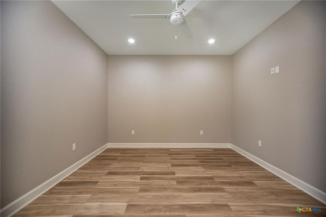 spare room featuring ceiling fan and hardwood / wood-style flooring