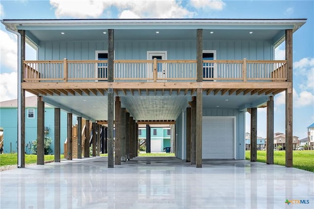 exterior space with a garage and a carport