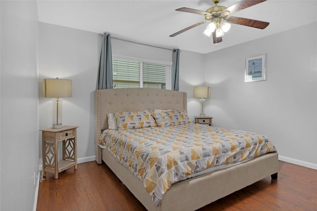 bedroom featuring dark hardwood / wood-style flooring and ceiling fan