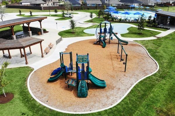 21576 Rolling Streams Dr, New Caney, TX 77357 - surrounding community with a playground and a yard