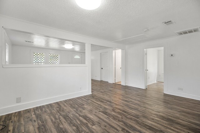 empty room featuring hardwood / wood-style floors and a textured ceiling