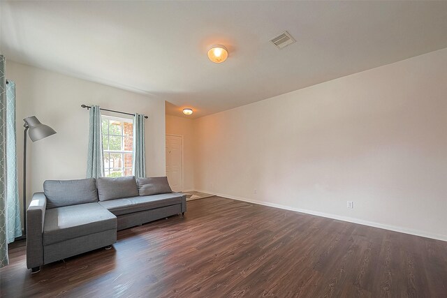 living room with dark wood-type flooring