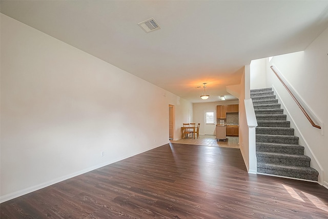 interior space with dark hardwood / wood-style floors