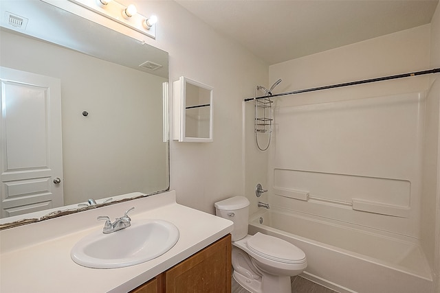 full bathroom with bathing tub / shower combination, toilet, and vanity