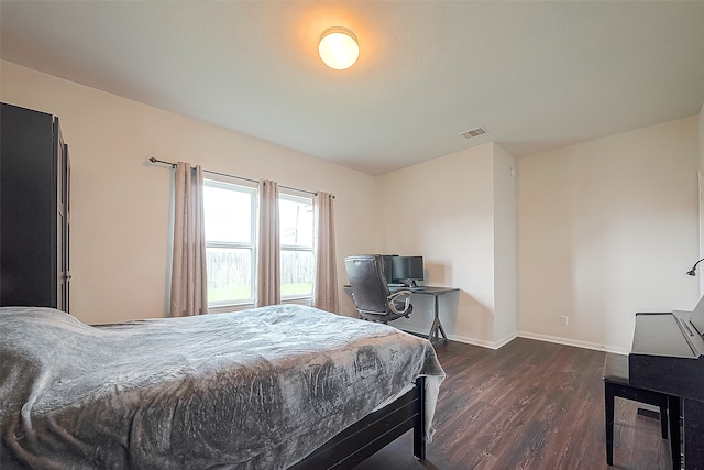 bedroom featuring dark wood-type flooring