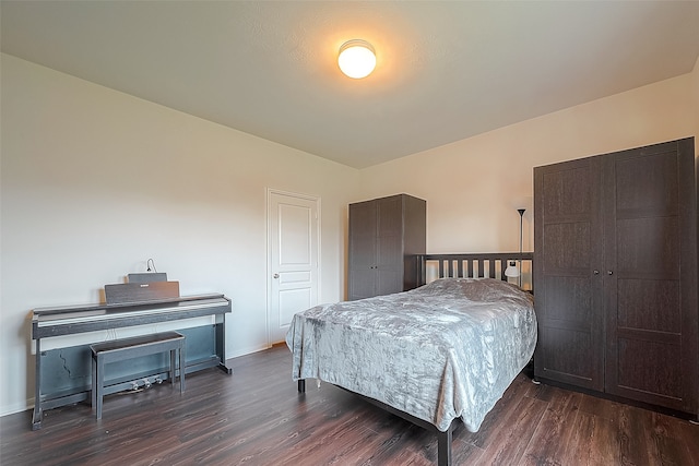 bedroom with hardwood / wood-style floors