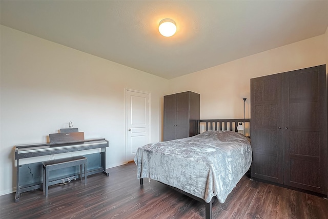 bedroom featuring dark hardwood / wood-style flooring