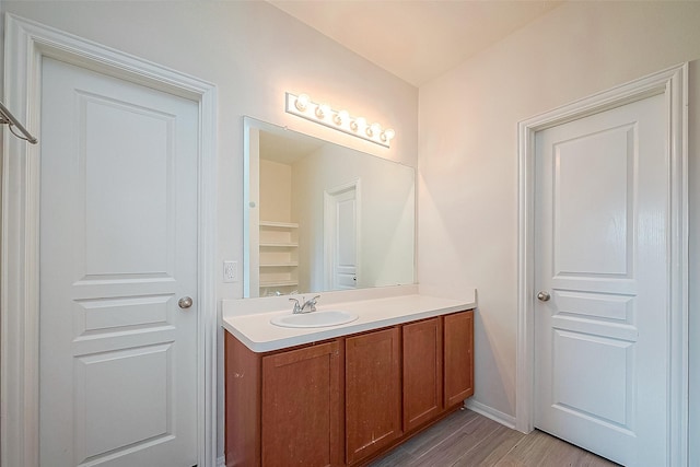 bathroom featuring vanity and hardwood / wood-style floors