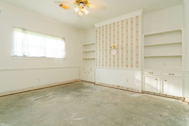 empty room featuring ceiling fan, built in shelves, and ornamental molding