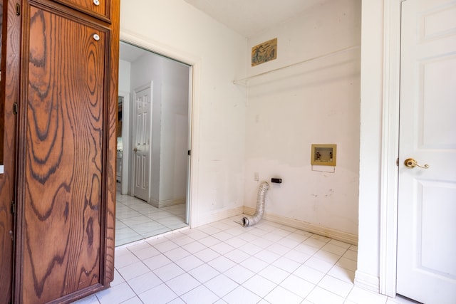 laundry area featuring light tile patterned flooring and washer hookup