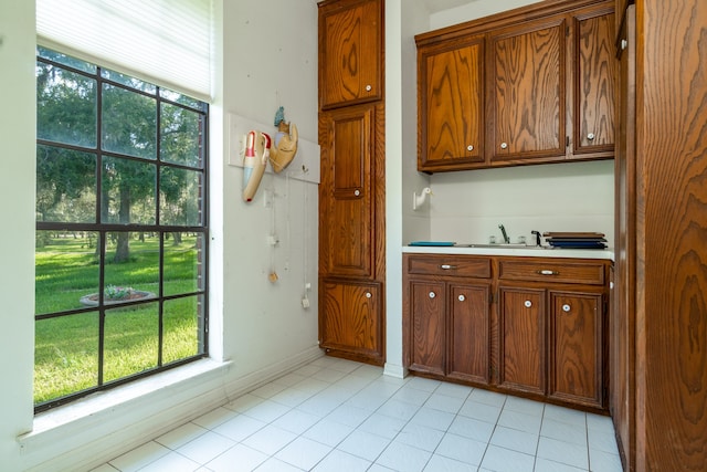 kitchen with sink and light tile patterned floors