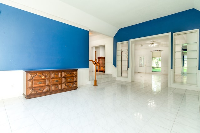 spare room featuring ceiling fan and light tile patterned floors