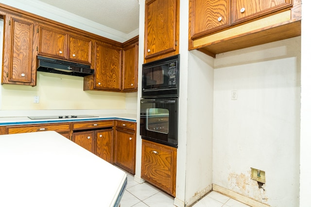 kitchen with crown molding, light tile patterned floors, and black appliances