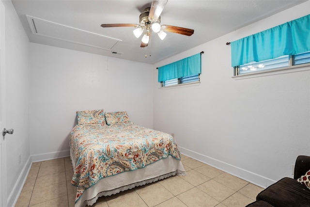 tiled bedroom featuring attic access, visible vents, ceiling fan, and baseboards