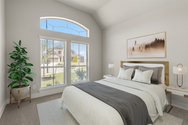 carpeted bedroom featuring lofted ceiling