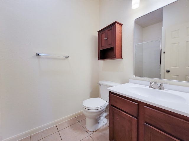 bathroom featuring tile patterned flooring, vanity, and toilet