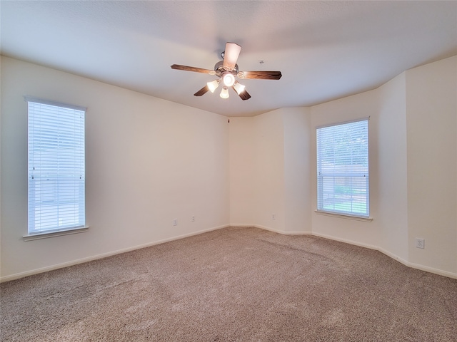 spare room with ceiling fan and carpet floors