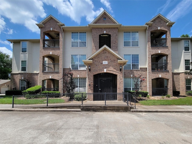 view of property with brick siding