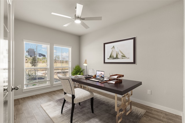 home office featuring hardwood / wood-style floors and ceiling fan