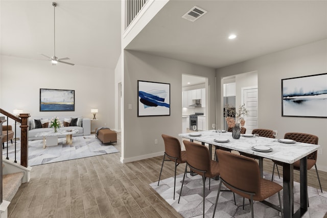 dining room featuring light hardwood / wood-style floors and ceiling fan