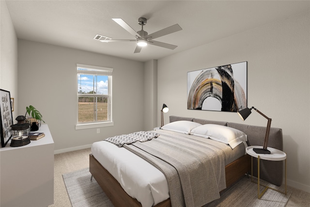 bedroom with ceiling fan and carpet floors