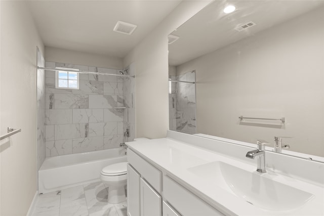 full bathroom with vanity, tiled shower / bath combo, and toilet