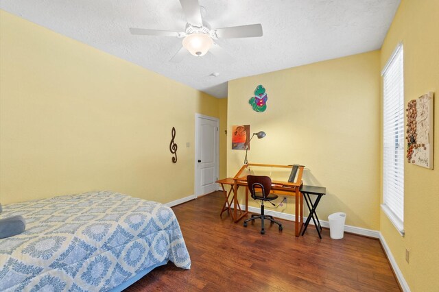 bedroom featuring a textured ceiling, ceiling fan, and hardwood / wood-style flooring