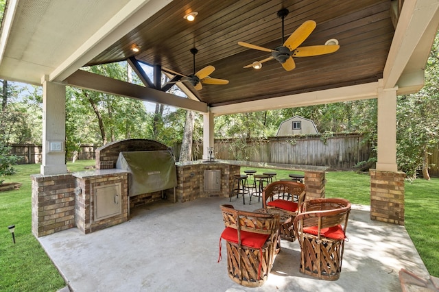 view of patio / terrace with ceiling fan and area for grilling