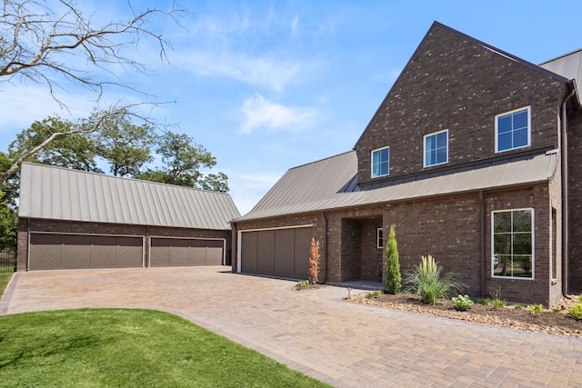 view of front facade with an outdoor structure and a garage