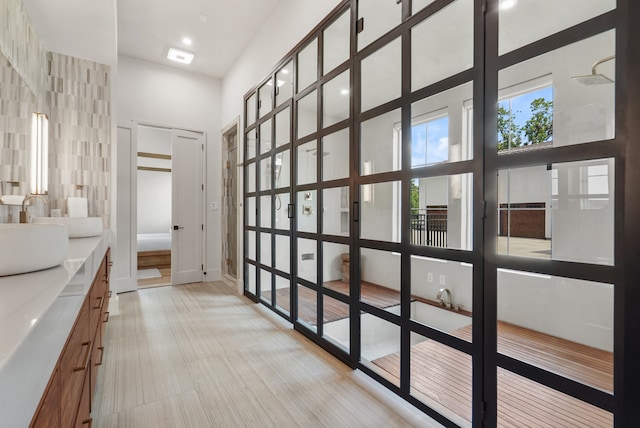 interior space featuring sink and tile walls