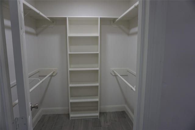 spacious closet with wood finished floors